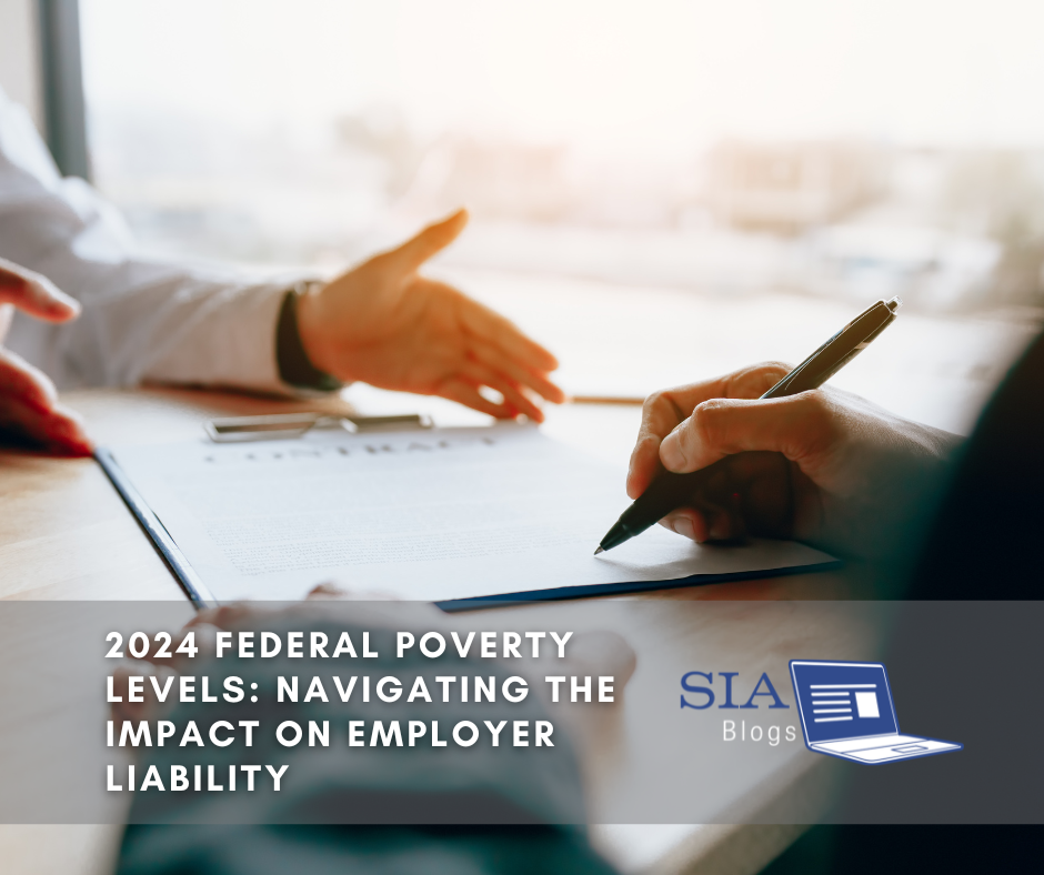 Two people are seated at a table, with one person holding a pen and signing a document while the other gestures towards the paperwork. The caption reads, "2024 Federal Poverty Levels: Navigating the Impact on Employer Liability," along with the SIA Blogs logo.