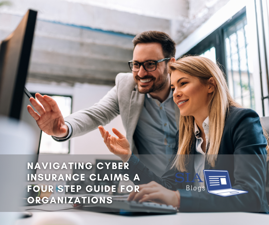 Two colleagues, a man and a woman, smile as they collaborate while looking at a computer screen. The caption reads, "Navigating Cyber Insurance Claims: A Four Step Guide for Organizations," along with the SIA Blogs logo.