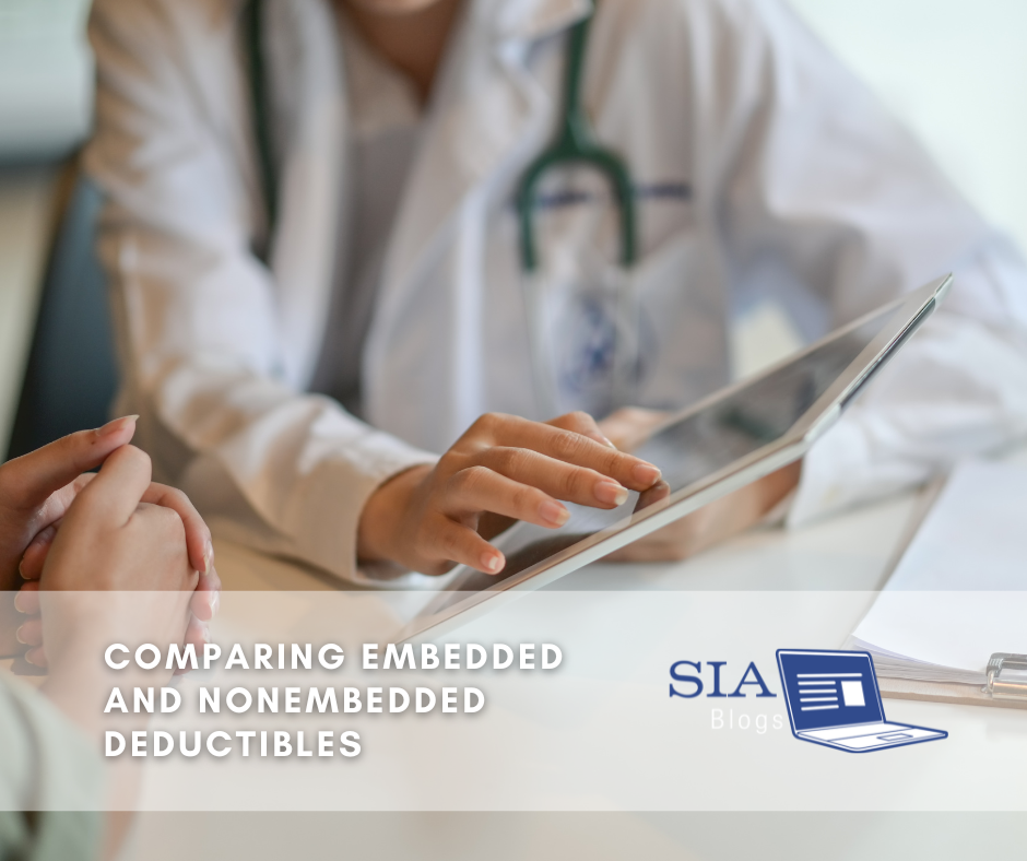A doctor wearing a white coat uses a tablet to explain something to a patient, focusing on the screen during the consultation. The caption reads, "Comparing Embedded and Nonembedded Deductibles," along with the SIA Blogs logo.