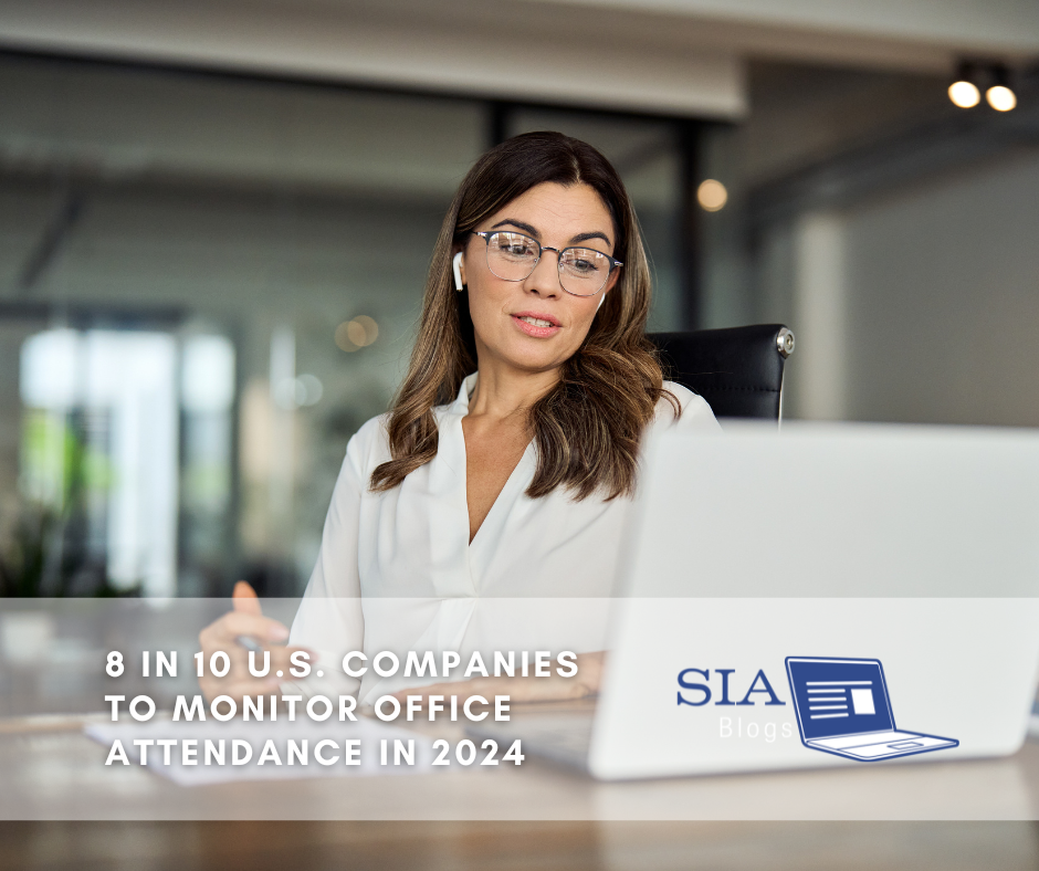 A woman sits at her desk, engaged in a video call on her laptop, wearing glasses and earbuds. The caption reads, "8 in 10 U.S. Companies to Monitor Office Attendance in 2024," along with the SIA Blogs logo.