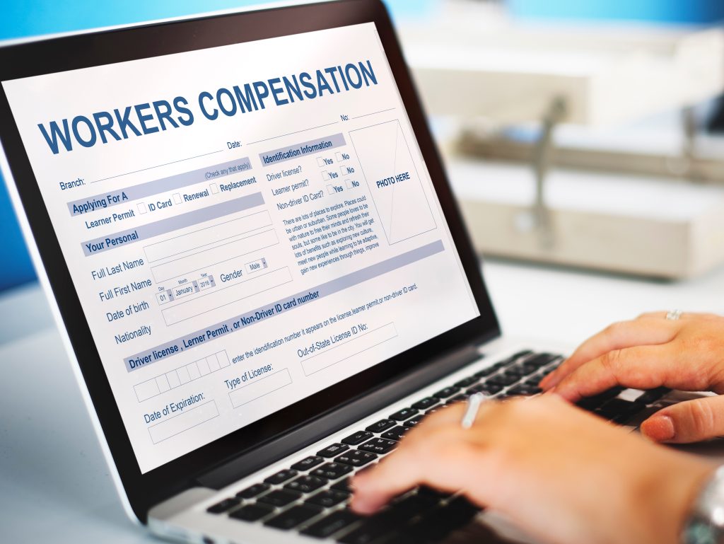 Workers' compensation claim form displayed on a laptop computer used for workplace injury and claims management.