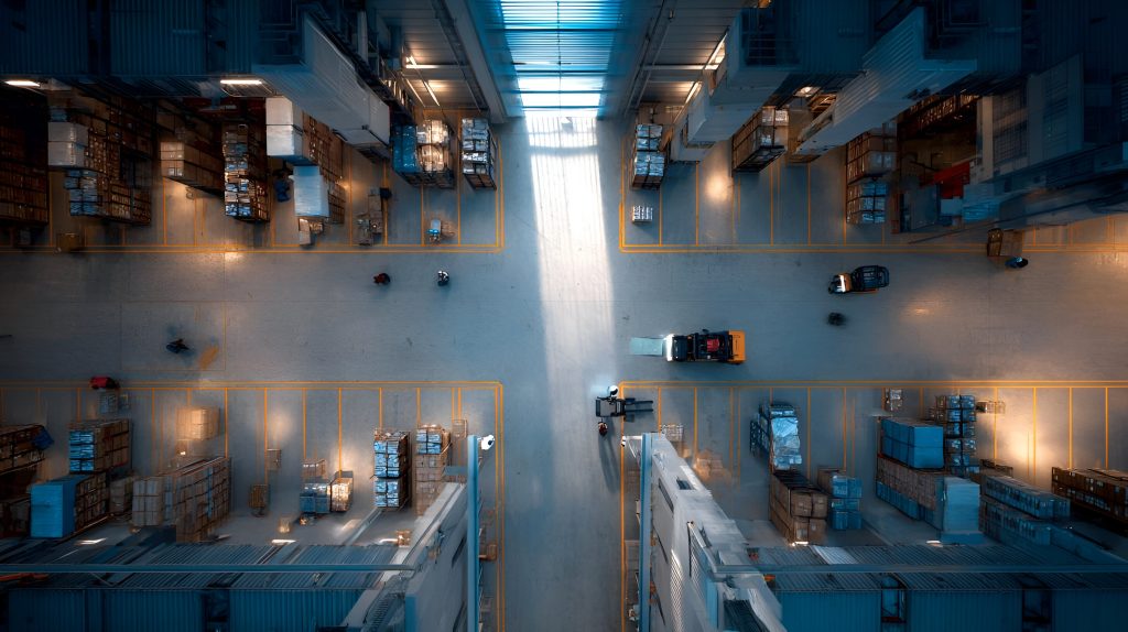 Overhead view of a warehouse facility illustrating commercial operations and business risk environments