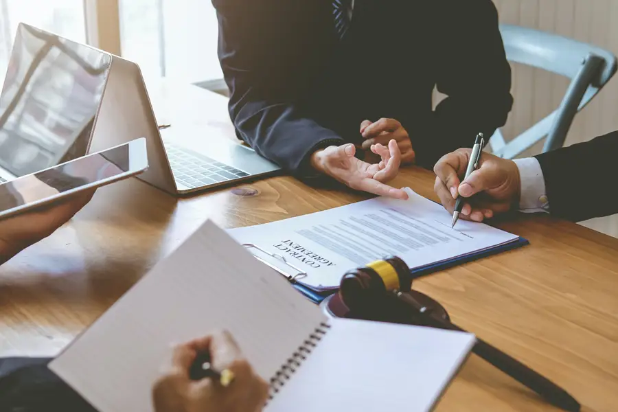 Man signing legal document