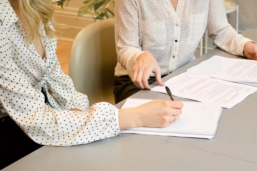 Women reviewing legal documents